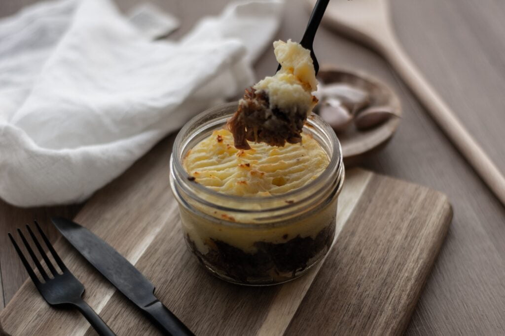 Parmentier con ragú de champiñones y nueces