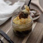 Parmentier con ragú de champiñones y nueces